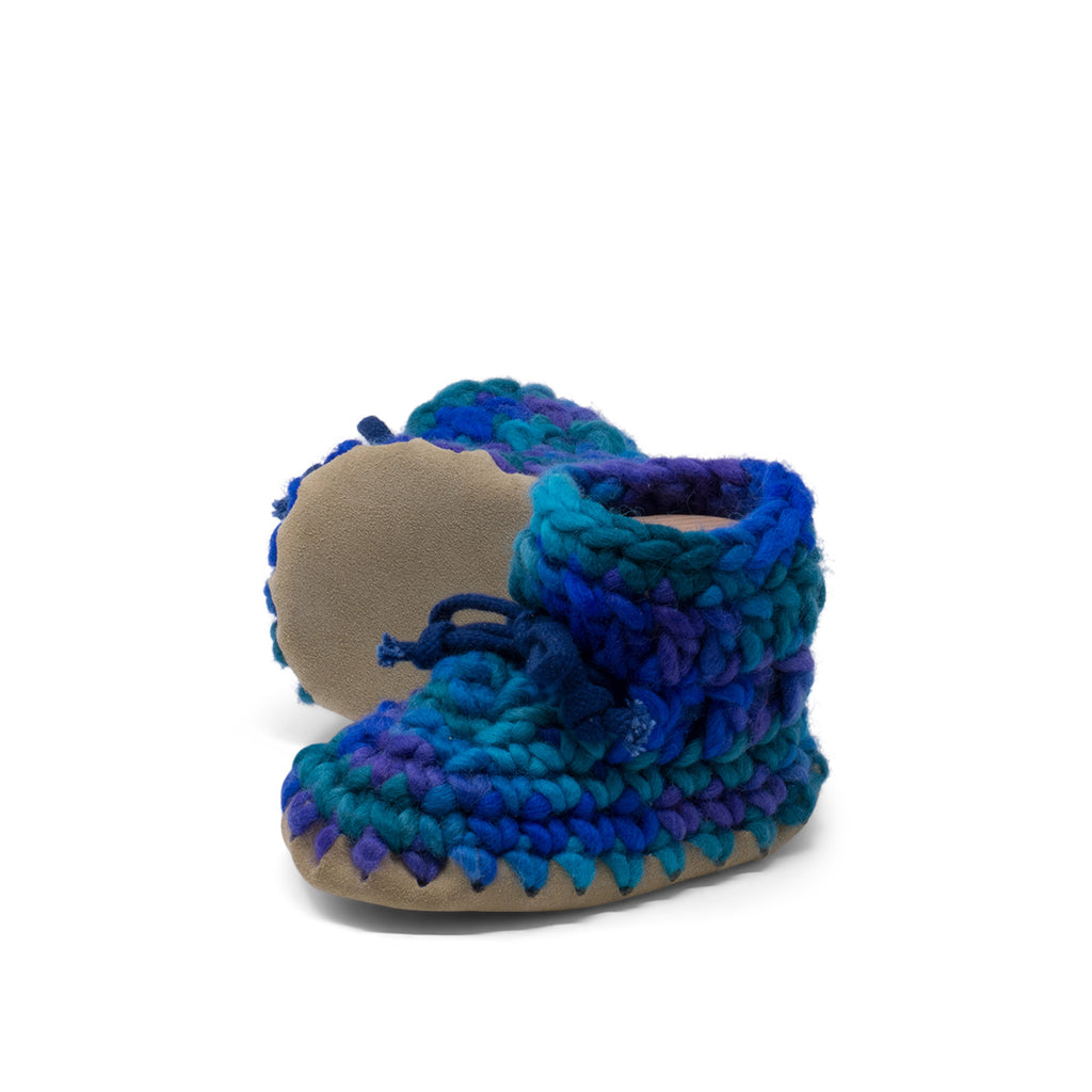 These wonderful hand-dyed wool crocheted slippers are made by a family business in Canada and are Elf-approved for their beauty, and eco-friendly production. Padraig slippers are an all-purpose slipper with the same great sheepskin soling. Innersoles are soft, genuine sheepskin, and outersoles feature non-slip suede. Wool will keep your foot cool and dry in warm weather, warm and dry in cold weather. Machine Washable, Sheepskin innersoles and non slip suede bottoms  Upper stretches to easily slip foot in.  