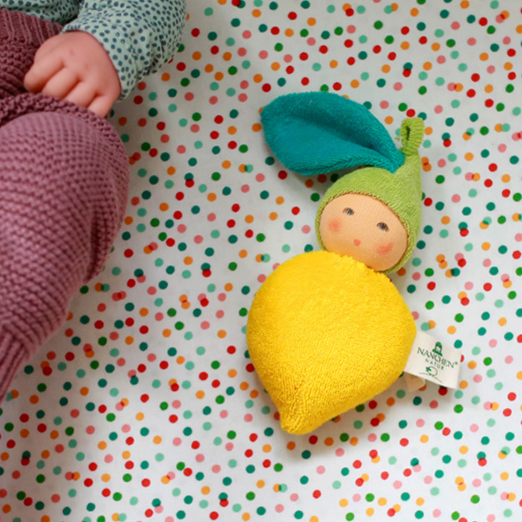The cutest lemon ever! Sweet and juicy... freshly picked, this little rattle is perfect for baby. Lovingly handmade to be just right for little hands to grasp, hold and love. Wonderfully charming and adorable to look at, the subtle expression is calming and comforting. A friend to have along anytime or a adorable gift!
Organic Cotton and Organic Wool
