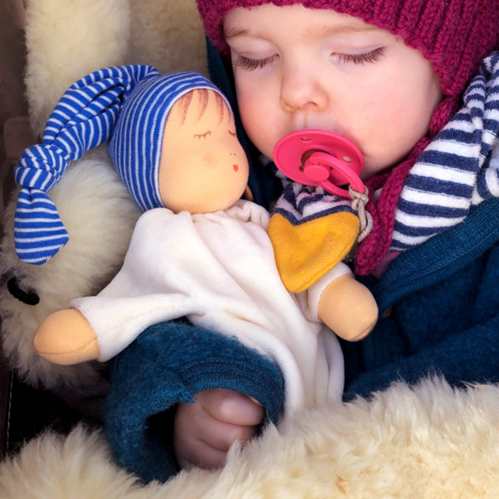 Nanchen Natur Sleeping Doll - Schlaf Schlafpupchen - Organic Cotton and Organic Wool 
Sweet, soft, cuddly and perfect for baby. Lovingly handmade to be just right for tiny hands to grasp and hold. Soothing, cozy, wonderfully soft and adorable to look at. Great at home or on the go and a perfect gift!