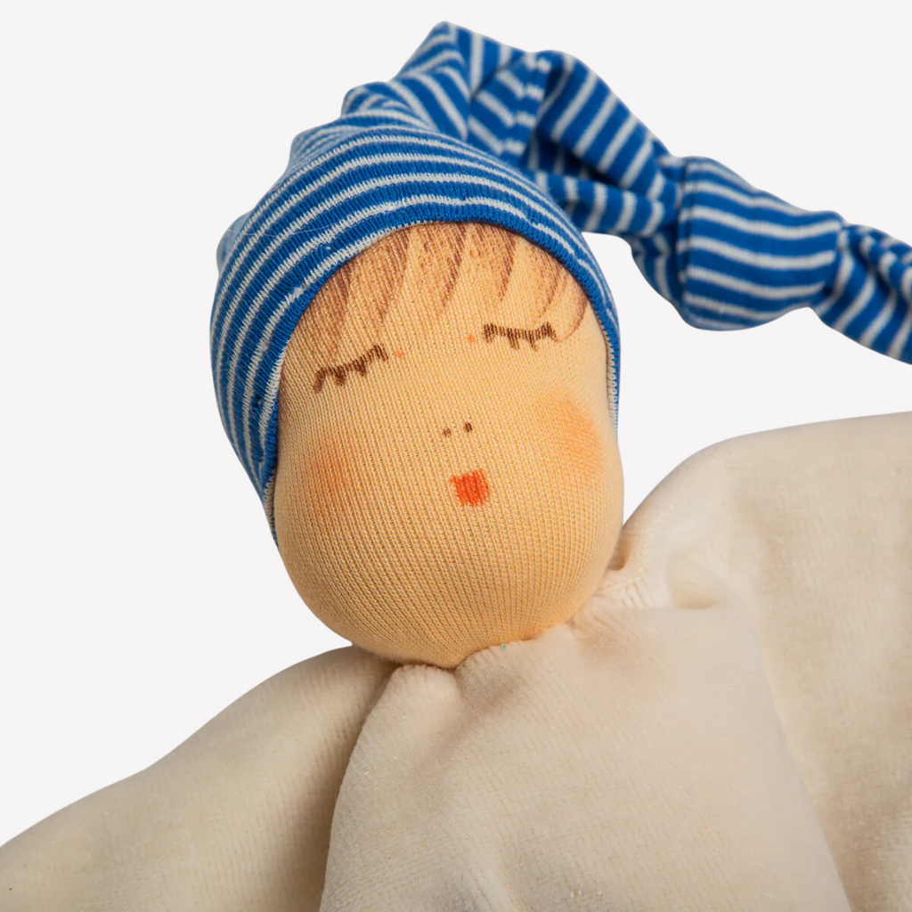 Nanchen Natur Sleeping Doll - Schlaf Schlafpupchen - Organic Cotton and Organic Wool 
Sweet, soft, cuddly and perfect for baby. Lovingly handmade to be just right for tiny hands to grasp and hold. Soothing, cozy, wonderfully soft and adorable to look at. Great at home or on the go and a perfect gift!