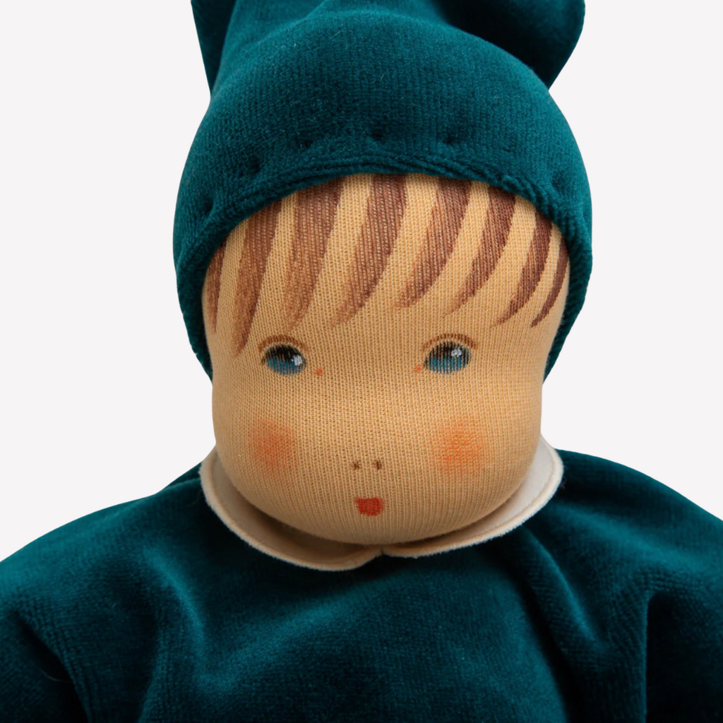 A lovely first doll for your baby to hold and snuggle. The subtle expression will charm and sooth your little one. Perfect for cuddles and a fun companion for tummy-time, this sweet doll will be a lifelong friend. 
Organic Cotton and Organic Wool
Painted Eyes and Mouth - Newborn Safe