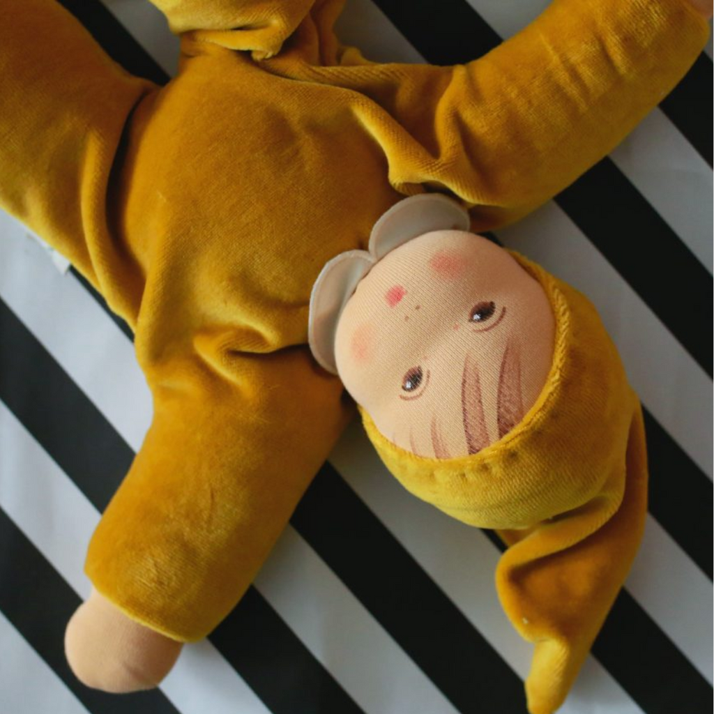 A lovely first doll for your baby to hold and snuggle. The subtle expression will charm and sooth your little one. Perfect for cuddles and a fun companion for tummy-time, this sweet doll will be a lifelong friend. 
Organic Cotton and Organic Wool
