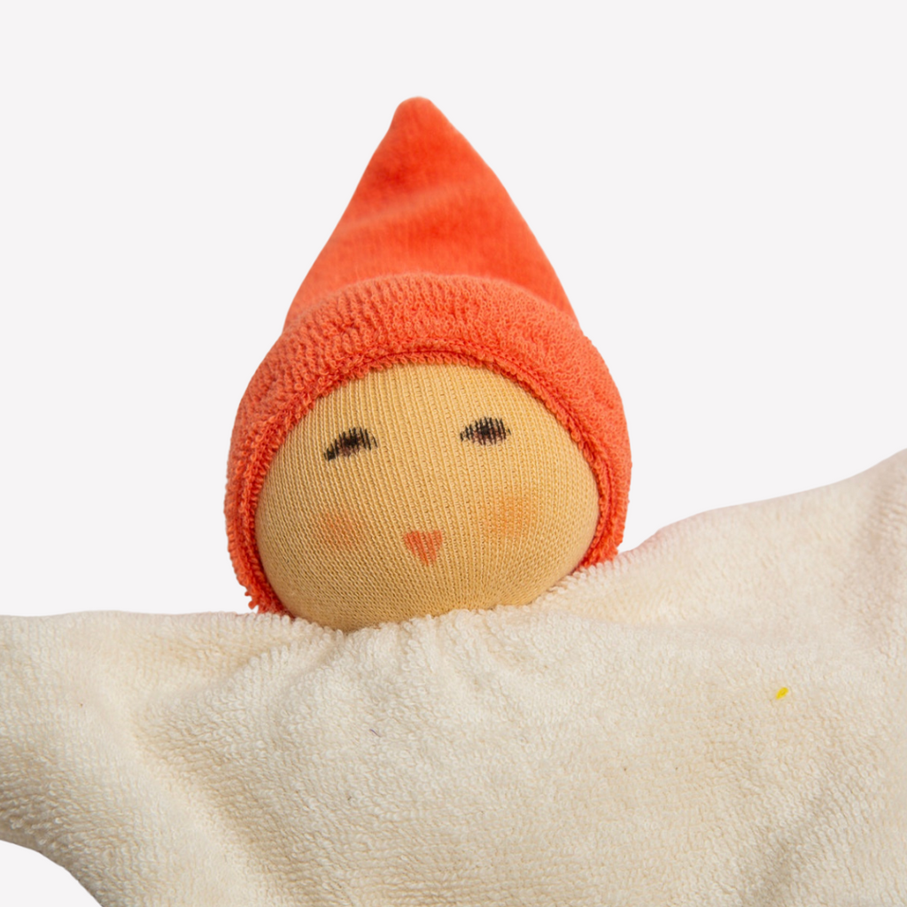 With a sweet smile, this adorable and incredibly soft doll will quickly become your little one's best friend. Soft to cuddle, sweet and friendly, a perfect companion for naps, car rides and perhaps a stroll in the park.   
Organic Cotton and Organic Wool
