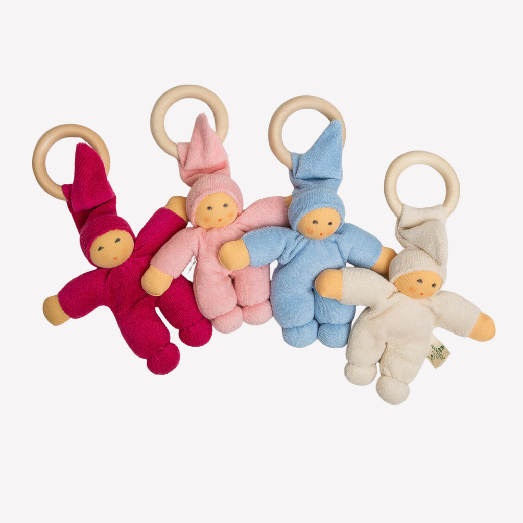 Sweet, soft, cuddly and perfect for baby. Lovingly handmade to be just right for tiny hands to grasp and hold. The wood ring is smooth and soothing on baby's gums. Wonderfully soft and adorable to look at. Great at home or on the go and a perfect gift! Each sold separately.

Organic Cotton and Organic Wool