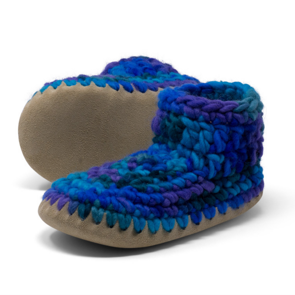 These wonderful hand-dyed wool crocheted slippers are made by a family business in Canada and are Elf-approved for their beauty, and eco-friendly production. Padraig slippers are an all-purpose slipper with the same great sheepskin soling. Innersoles are soft, genuine sheepskin, and outersoles feature non-slip suede. Wool will keep your foot cool and dry in warm weather, warm and dry in cold weather. Machine Washable, Sheepskin innersoles and non slip suede bottoms  Upper stretches to easily slip foot in.  