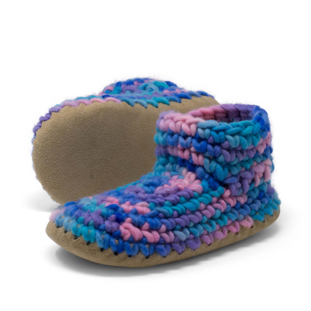 These wonderful hand-dyed wool crocheted slippers are made by a family business in Canada and are Elf-approved for their beauty, and eco-friendly production. Padraig slippers are an all-purpose slipper with the same great sheepskin soling. Innersoles are soft, genuine sheepskin, and outersoles feature non-slip suede. Wool will keep your foot cool and dry in warm weather, warm and dry in cold weather. Machine Washable, Sheepskin innersoles and non slip suede bottoms  Upper stretches to easily slip foot in.  
