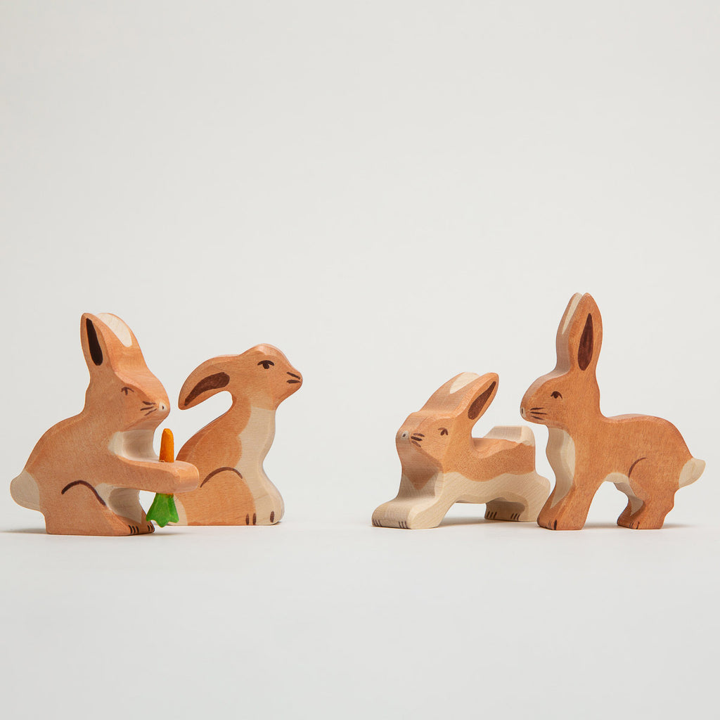 Hare With Carrot - Holztiger - Wooden Figure - The Acorn Store - Décor This lovely hare looks rather pleased with himself having bagged a delicious carrot to chew on. Grasping hold of the carrot between his paws just as they do in real life. Let’s hope the farmer doesn't catch him raiding the fields! Perfect for teaming up with other woodland creatures and forest friends.